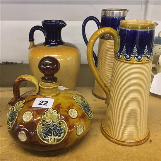 2 x Doulton stoneware ribbed jugs, one with silver rim, one other jug and a dimpled flask